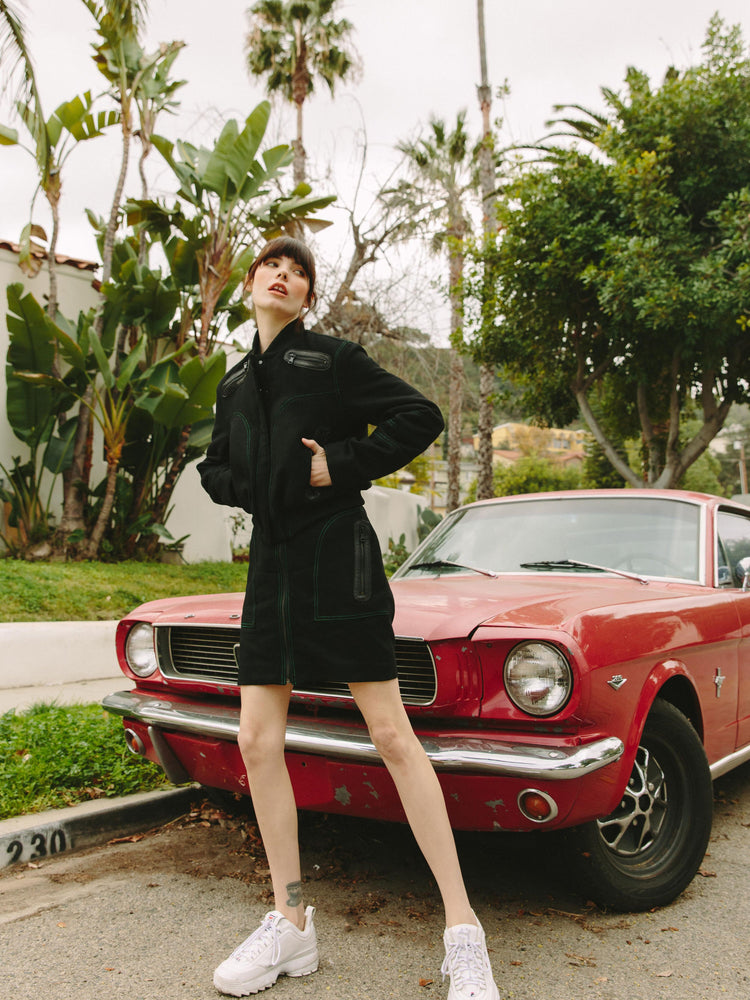 
                  
                    Woman near the red mustang in stowaway skirt
                  
                